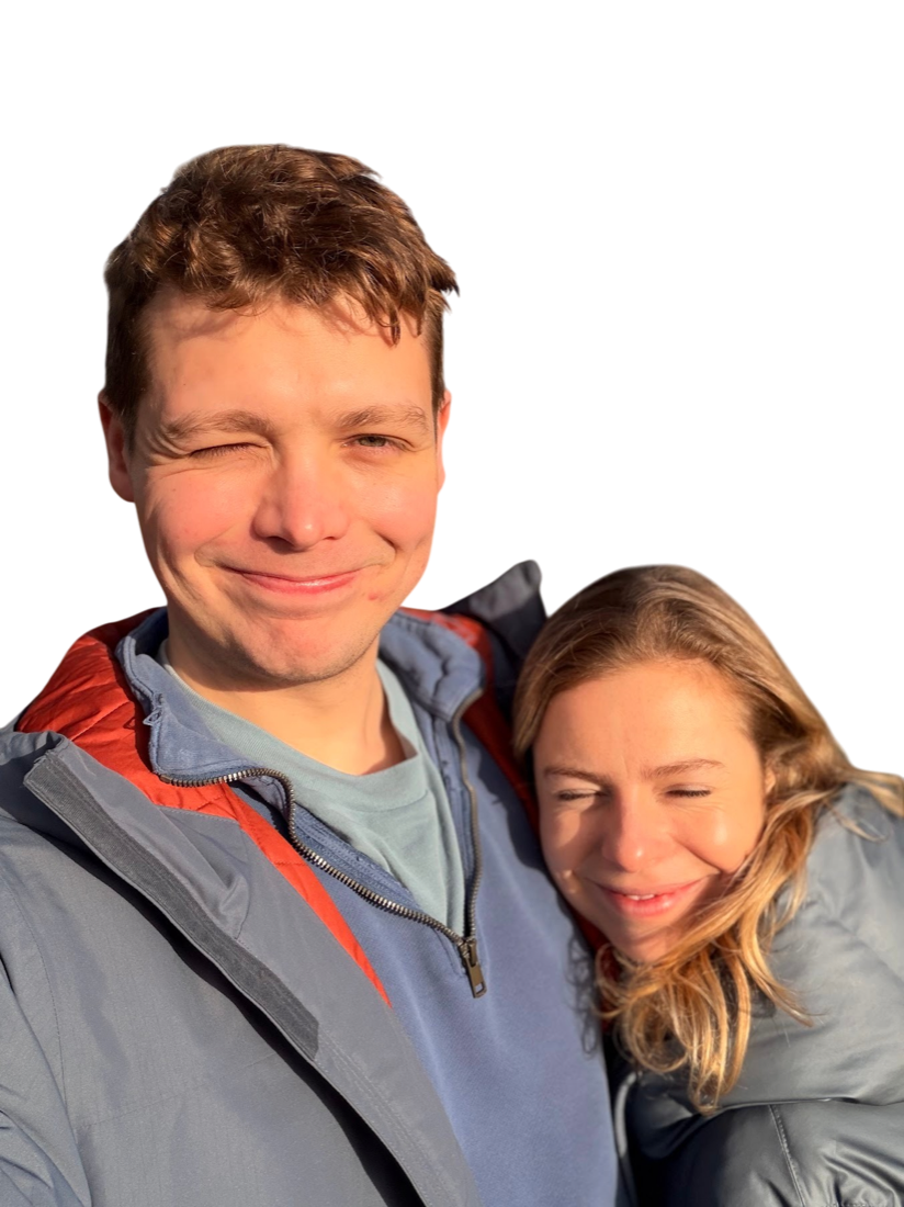 Nat winking, with Fan laughing on his shoulder.
